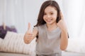 Sunny little girl demonstrating injured finger at home Royalty Free Stock Photo