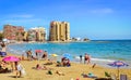 Sunny Mediterranean beach, Tourists relax on sand