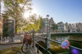 Sunny Morning in Amsterdam and Bridge With Bicycles Royalty Free Stock Photo