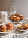 Sunny morning breakfast caramel and chocolate muffins with glass of milk