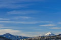 The city of Quito surrounded by the Sincholagua and Cotopaxi volcanoes