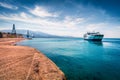 Sunny morning panorama of Rion-Antirion Bridge and ferryboat. Colorful spring view of the Gulf of Corinth, Greece, Europe. Royalty Free Stock Photo