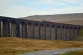 Sunny Morning at the Ribblehead Viaduct with EWS freight train crossing.UK
