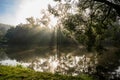 Sunny morning with sun ray on river bank, Kolodeje nad Luznici Royalty Free Stock Photo