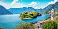 Sunny morning view of Comocina island from the hiil of Ossuccio village, Province of Como, region Lombardy, Italy, Europe. Superb Royalty Free Stock Photo