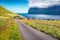 Sunny morning view of Mikladalur villagr, Kalsoy island. Bright summer scene of Faroe Islands, Denmark, Europe. Fantastic seascape