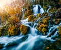 Sunny morning view of pure water waterfall in Plitvice National Park. Fantastic sunrise on autumn forest in Croatia, Europe. Beaut Royalty Free Stock Photo