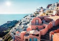 Sunny morning view of Santorini island. Picturesque spring scene of the famous Greek resort Oia, Greece, Europe. Traveling concept Royalty Free Stock Photo
