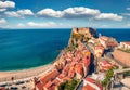 Sunny morning view of Scilla town with Ruffo castle on background, administratively part of the Metropolitan City of Reggio Calabr Royalty Free Stock Photo