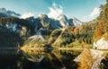 Sunny morning, at Vorderer Gosausee lake. picturesque autumn scenery. Lake under Warm sun. view of Austrian Alps, Austria, Europe Royalty Free Stock Photo