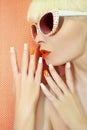 Sunny orange manicure and makeup. Royalty Free Stock Photo