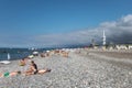 Sunny pebble beach in Batumi full of people Black sea