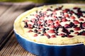 Sunny Photo with a morning breakfast in rustic style. Cheesecake raspberries and blueberries on wooden table.