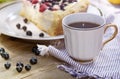 Sunny Photo with a morning breakfast in rustic style. Cheesecake raspberries and blueberries on wooden table.