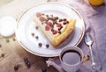 Sunny Photo with a morning breakfast in rustic style. Cheesecake raspberries and blueberries on wooden table.