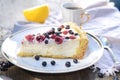 Sunny Photo with a morning breakfast in rustic style. Cheesecake raspberries and blueberries on wooden table.