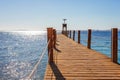 Sunny pier at the coast of Red Sea in Sharm el Sheikh, Sinai, Egypt, Asia in summer hot. ÃÂ¡oral reef and crystal clear water. Royalty Free Stock Photo