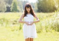 Sunny pretty pregnant woman outdoors Royalty Free Stock Photo