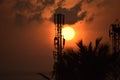 Sunny red sunset in Quiet evening time, Tower, trees and clouds. in india, chennai