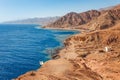 Sunny resort beach at the coast shore of Red Sea in Dahab, Sinai, Egypt, Asia in summer hot. Famous tourist destination Blue Hole