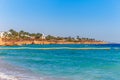 Sunny resort beach with palm tree at the coast shore of Red Sea in Sharm el Sheikh, Sinai, Egypt, Asia in summer hot. Bright sunny Royalty Free Stock Photo