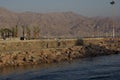 Sunny rocky beach by the red sea in resort city Eilat, Israel Royalty Free Stock Photo