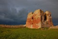 Sunny ruin tower under dark skies Royalty Free Stock Photo