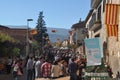 Sunny scenery of a crowded fair in Catalonia