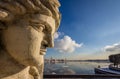 Sunny sculpture of Rostral column and Neva river cityscape Royalty Free Stock Photo