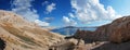 Sunny sea and mountains with blue sky