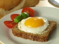 Sunny side up egg on a slice of bread