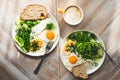Sunny side up fried eggs with healthy green salad for breakfast Royalty Free Stock Photo