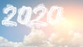 Sunny sky cloud year 2020. Happy New year concept. Numbers 2020 symbol inscription on background of blue sky from white smoke of Royalty Free Stock Photo