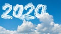 Sunny sky cloud year 2020. Happy New year concept. Numbers 2020 symbol inscription on background of blue sky from white smoke of Royalty Free Stock Photo