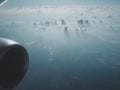 Sunny sky with white clouds on plane. Cloudscape as seen on aircraft.