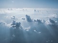 Sunny sky with white clouds on plane. Cloudscape as seen on aircraft. Above the cloud.