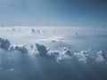 Sunny sky with white clouds on plane. Cloudscape as seen on aircraft.