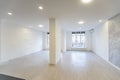 Sunny spacious hangar area with concrete floor and windows in floor.