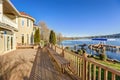 Sunny spacious walkout deck of luxurious waterfront home Royalty Free Stock Photo