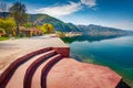 Sunny spring cityscape of Pogradec town. Stunning morning scene of Ohrid lake. Royalty Free Stock Photo