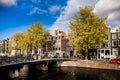 Sunny spring day in Amsterdam. Canal view with traditional houses and bicycles, Netherlands Royalty Free Stock Photo