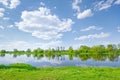 Sunny spring landscape water river blue sky clouds Royalty Free Stock Photo