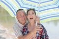 sunny spring summer portrait couple under umbrella Royalty Free Stock Photo