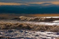 Sunny stormy waves on the shore
