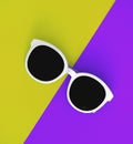 Sunny stylish white sunglasses on a bright purple-lilac and yellow-green background, top view, isolated. Copy space. Flat lay Royalty Free Stock Photo