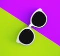 Sunny stylish white sunglasses on a bright purple-lilac and yellow-green background, top view, isolated. Copy space. Flat lay Royalty Free Stock Photo