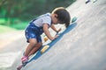 A lively little boy is playing a climbing game