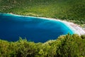 Sunny summer day on Antisamos beach on Kefalonia island, Greece. Crystal clear water, huge hills beautiful white beach Royalty Free Stock Photo