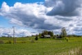 Latvian countryside with old houses and barns in the green grass