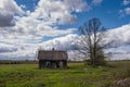 Latvian countryside with old houses and barns in the green grass